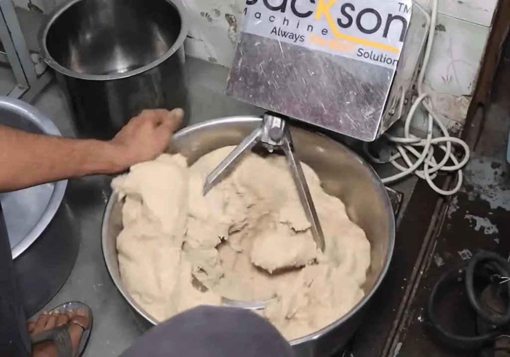 A Person Mixing Flour